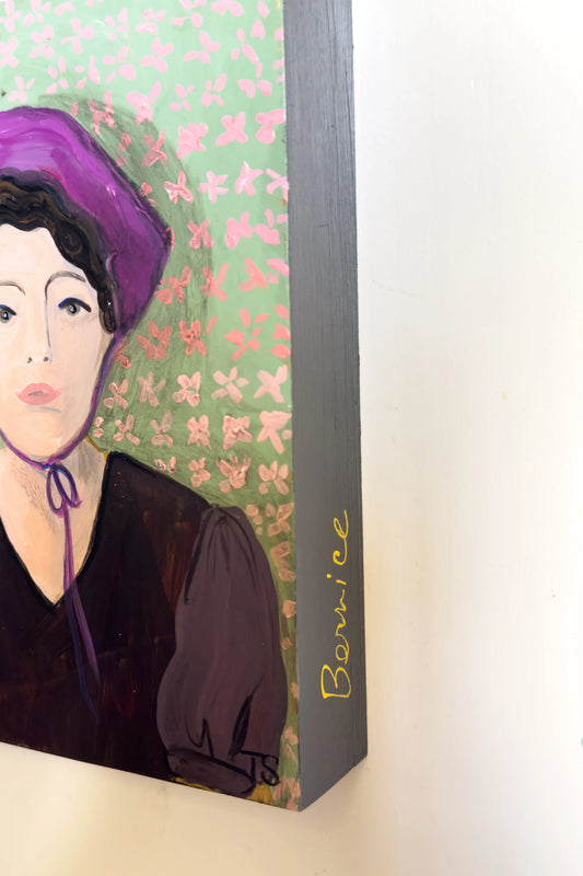 Framed artwork of a woman with purple hair against a floral background, side view of original painting titled "Bernice" by artist Teri Stephens