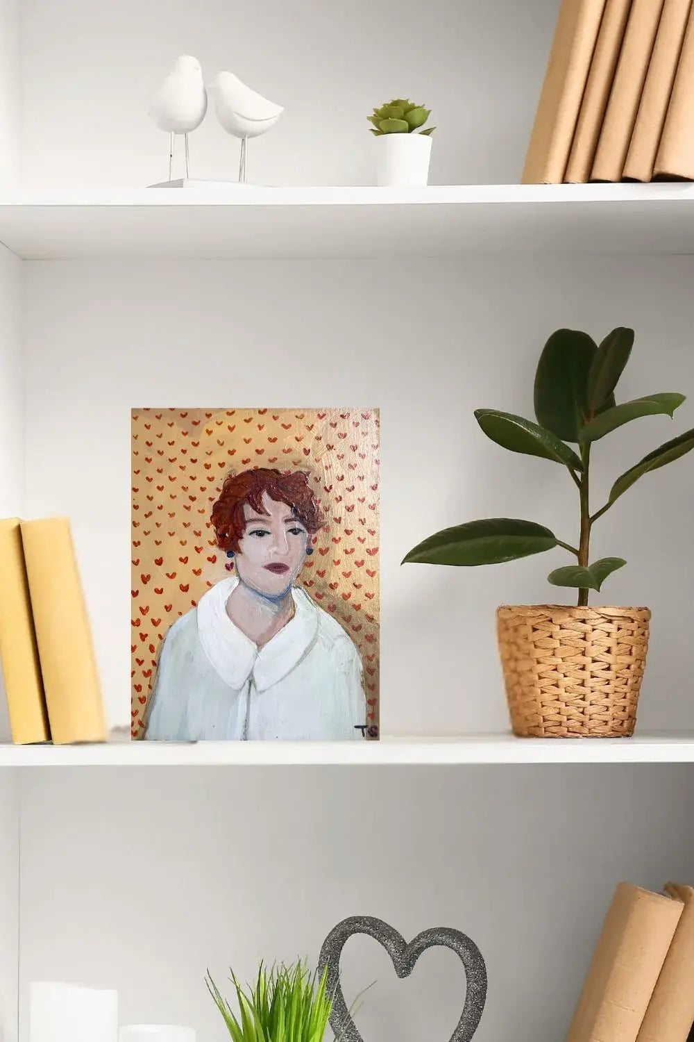 Clementine is No. 3 of 16 in the Whimsical Portrait Series by Teri Stephens Art. Features a woman with curling red hair against a golden background patterned with red hearts.