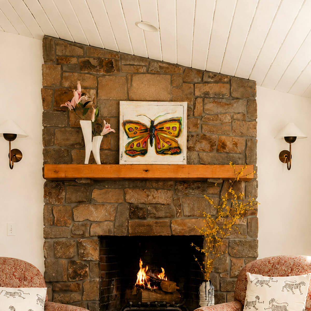 Original Butterfly Paintings by artist Teri Stephens, styled in a warm interior on a fireplace with wood mantel.
