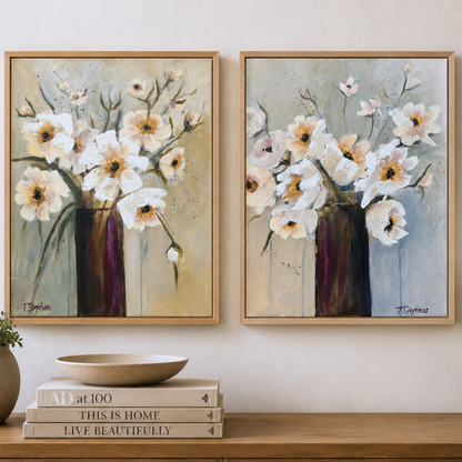 Two framed floral paintings on a wall above a wooden shelf with decorative items. Original paintings by artist Teri Stephens