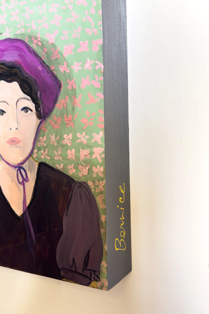 Framed artwork of a woman with purple hair against a floral background, side view of original painting titled "Bernice" by artist Teri Stephens