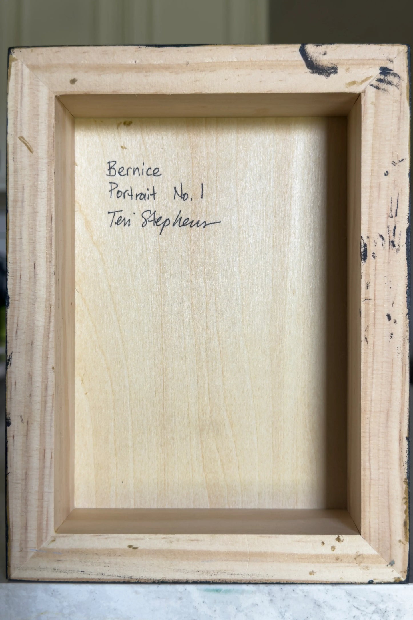 Wooden picture frame with 'Bernice Portrait No. 1 Teri Stephens' text inside