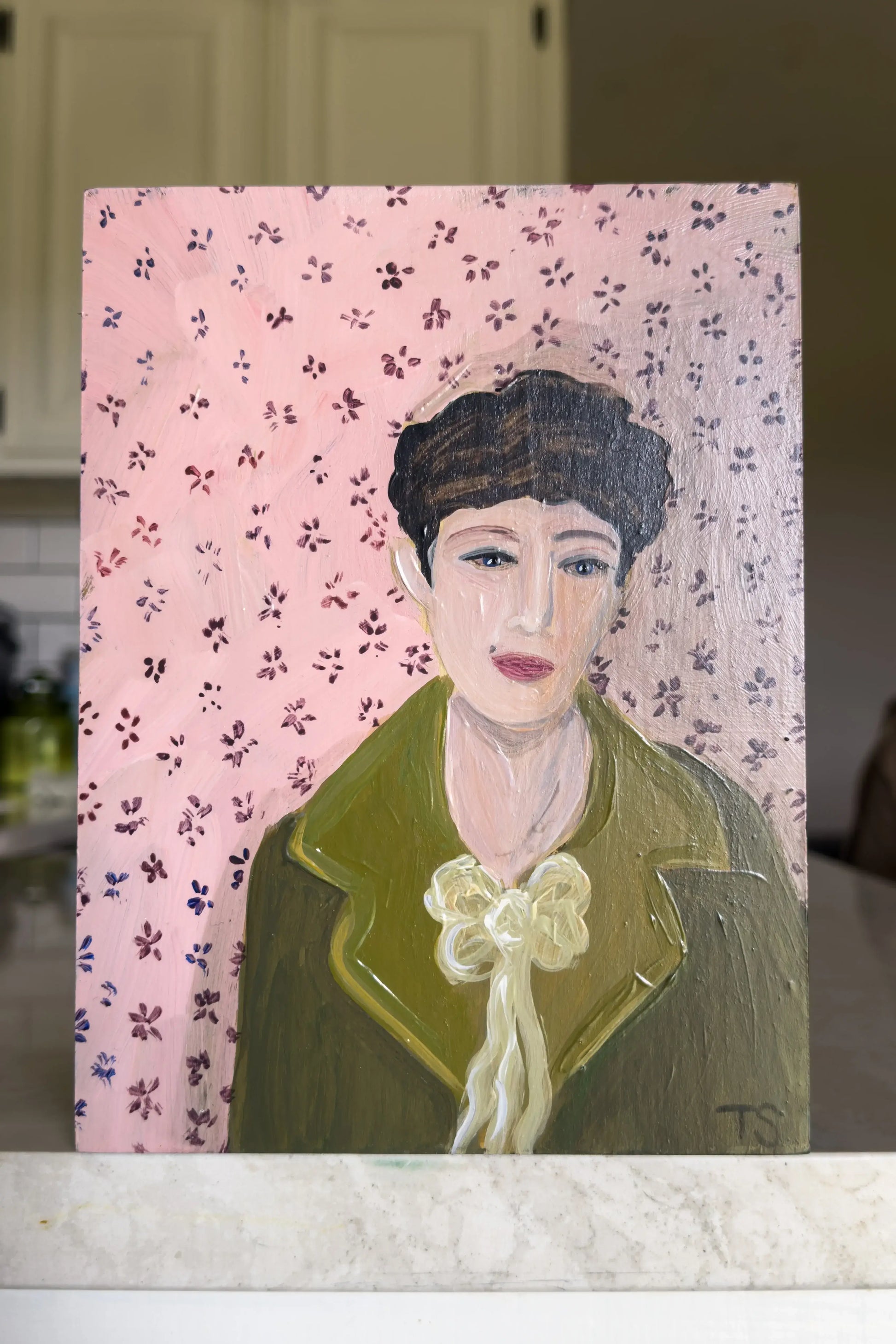 Painting of a woman with a floral patterned background, title: Birdie by Tennessee artist, Teri Stephens