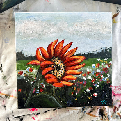 Painting of a sunflower in a field with a colorful background, title Blaze by artist Teri Stephens