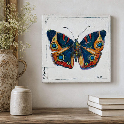 Original butterfly painting by artist Teri Stephens titled Buckeye featuring rich blue tones and shades of orange and red