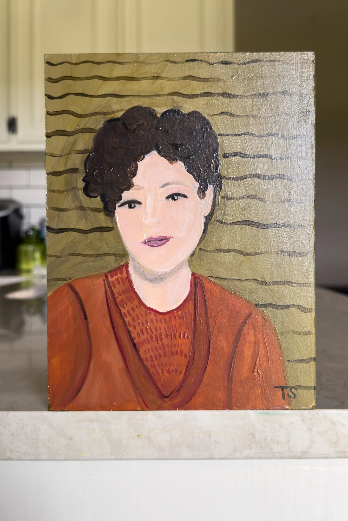 Painting of a person wearing a red sweater on a textured surface