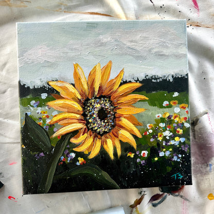 Painting of a sunflower with a colorful background on a textured surface, title Golden by artist Teri Stephens