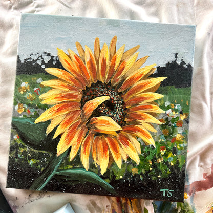Painting of a sunflower with a garden background on a textured surface, title Halo by artist Teri Stephens