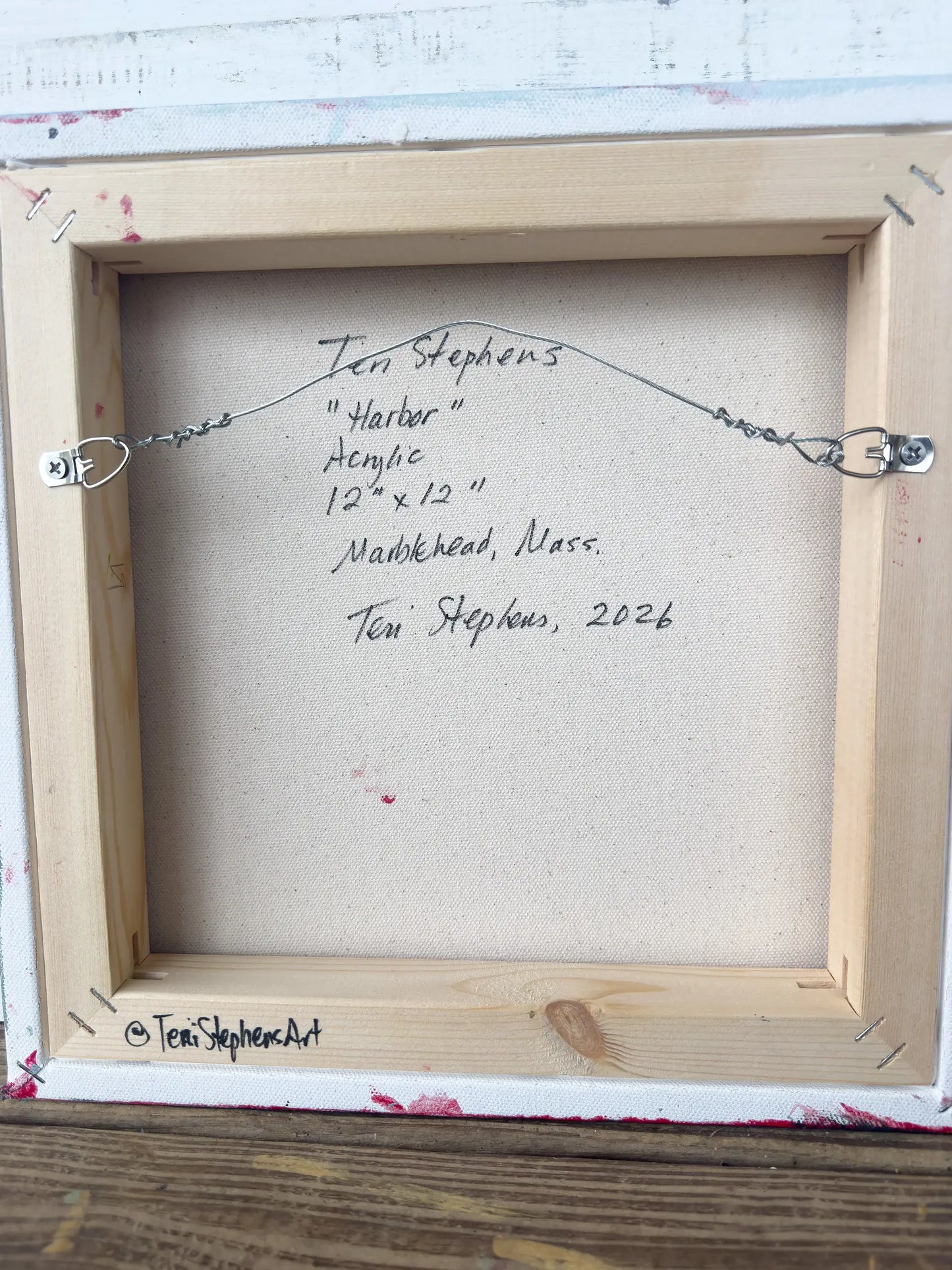 Back of a framed artwork with artist's signature and details, original painting titled "Harbor" by Teri Stephens