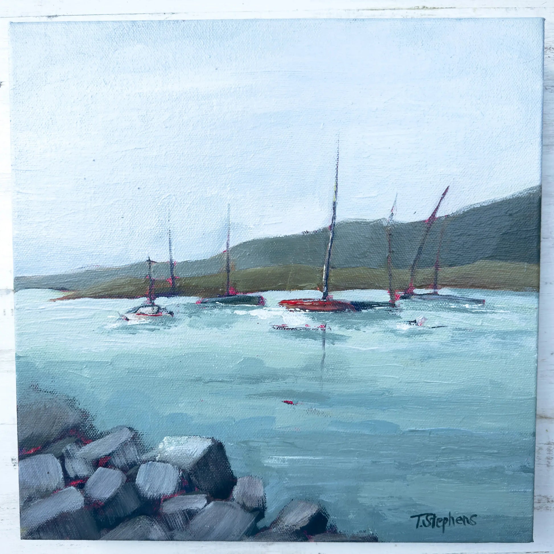 Painting of sailboats on a body of water with a coastal landscape. original painting titled "Harbor" by Teri Stephens