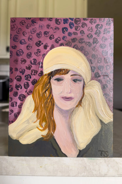 Painting of a woman with a yellow headscarf on a pink floral background