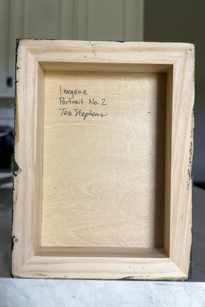 Wooden picture frame with text on a neutral background