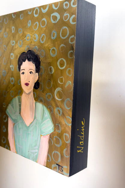 Painting of a woman with a gold circular patterned background on a wooden panel.