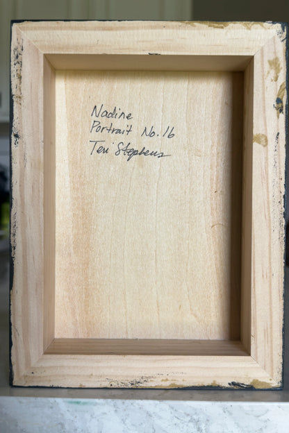 Back of a wooden frame with text 'Nadine Portrait No. 16 Teri Stephens'