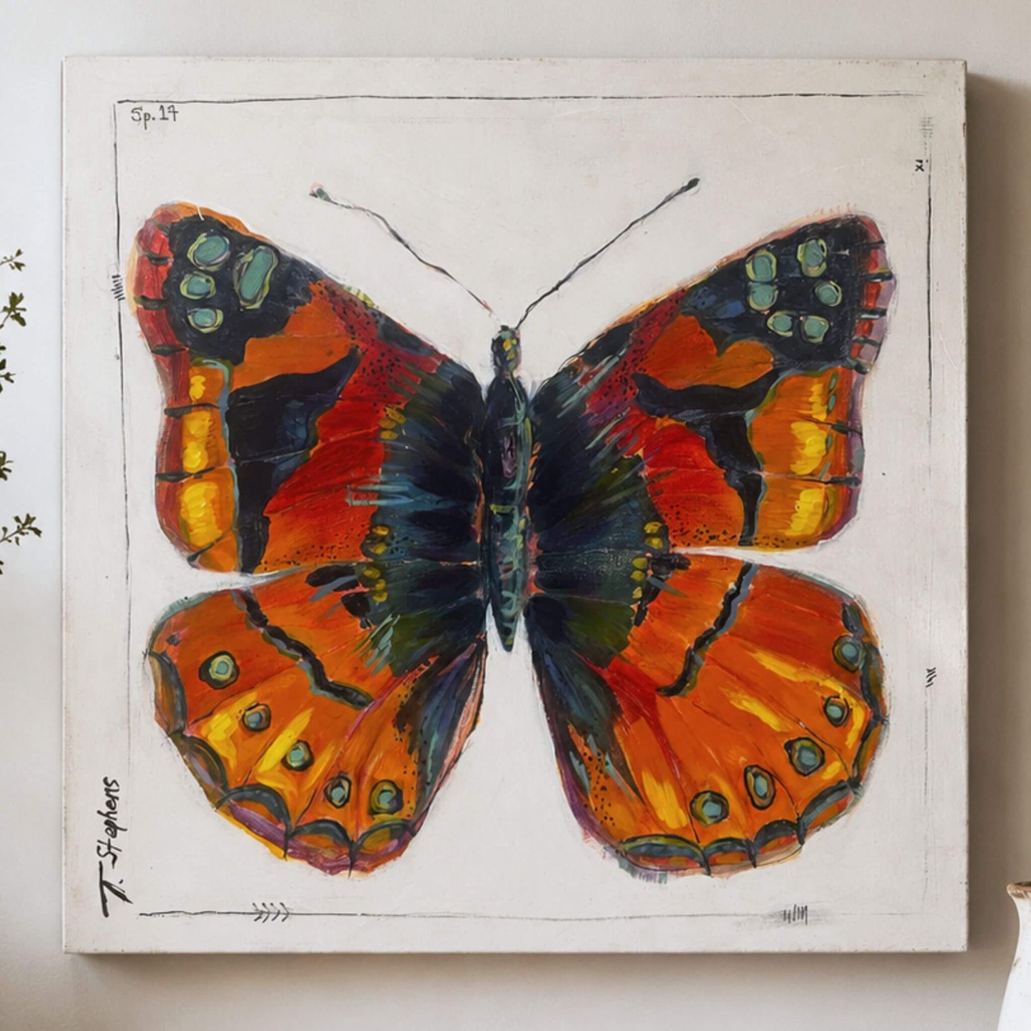 Painted is an original butterfly painting of a Painted Lady butterfly, reimagined in bold colors of orange, yellow, blue and green. By Tennessee artist Teri Stephens