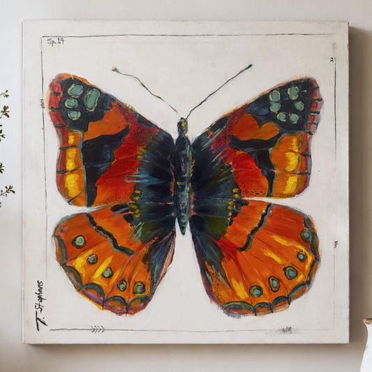 Painted is an original butterfly painting of a Painted Lady butterfly, reimagined in bold colors of orange, yellow, blue and green. By Tennessee artist Teri Stephens