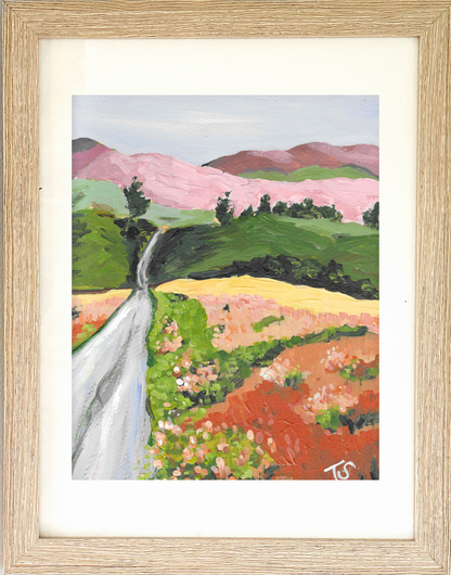 Framed painting of a landscape with a waterfall and pink mountains. "Path" by artist Teri Stephens