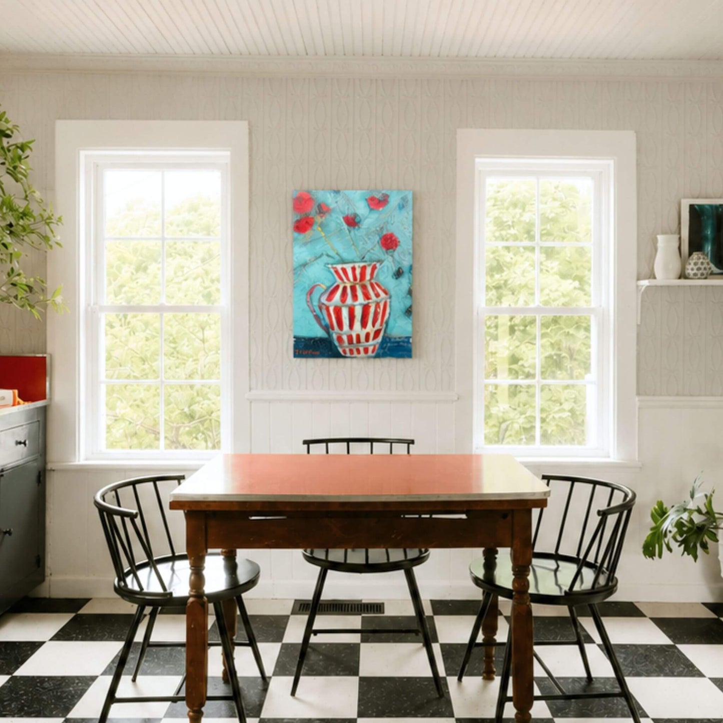 Bright modern farmhouse dining room showcasing an original striped pitcher painting by Tennessee artist Teri Stephens displayed above a dining table.