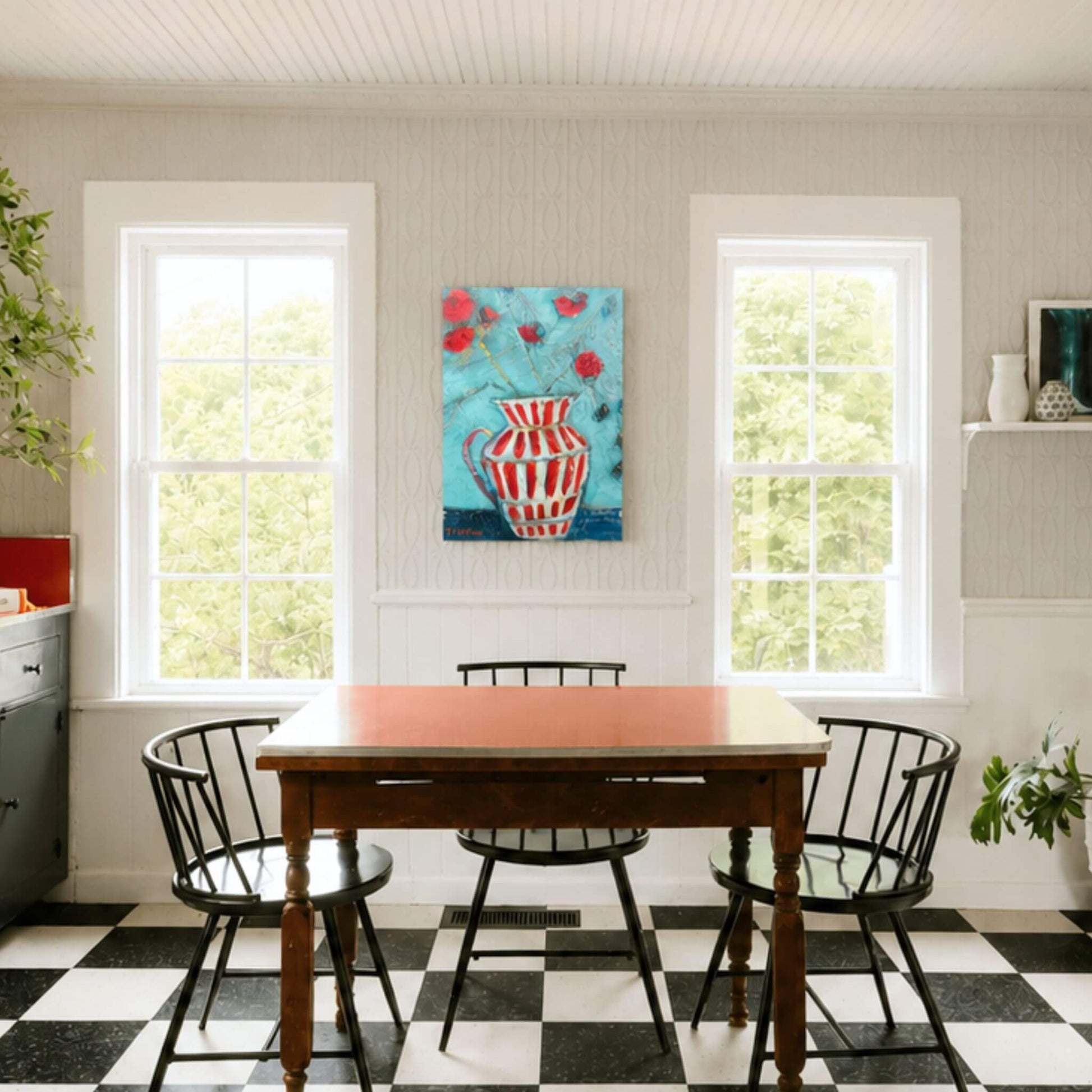 Bright modern farmhouse dining room showcasing an original striped pitcher painting by Tennessee artist Teri Stephens displayed above a dining table.