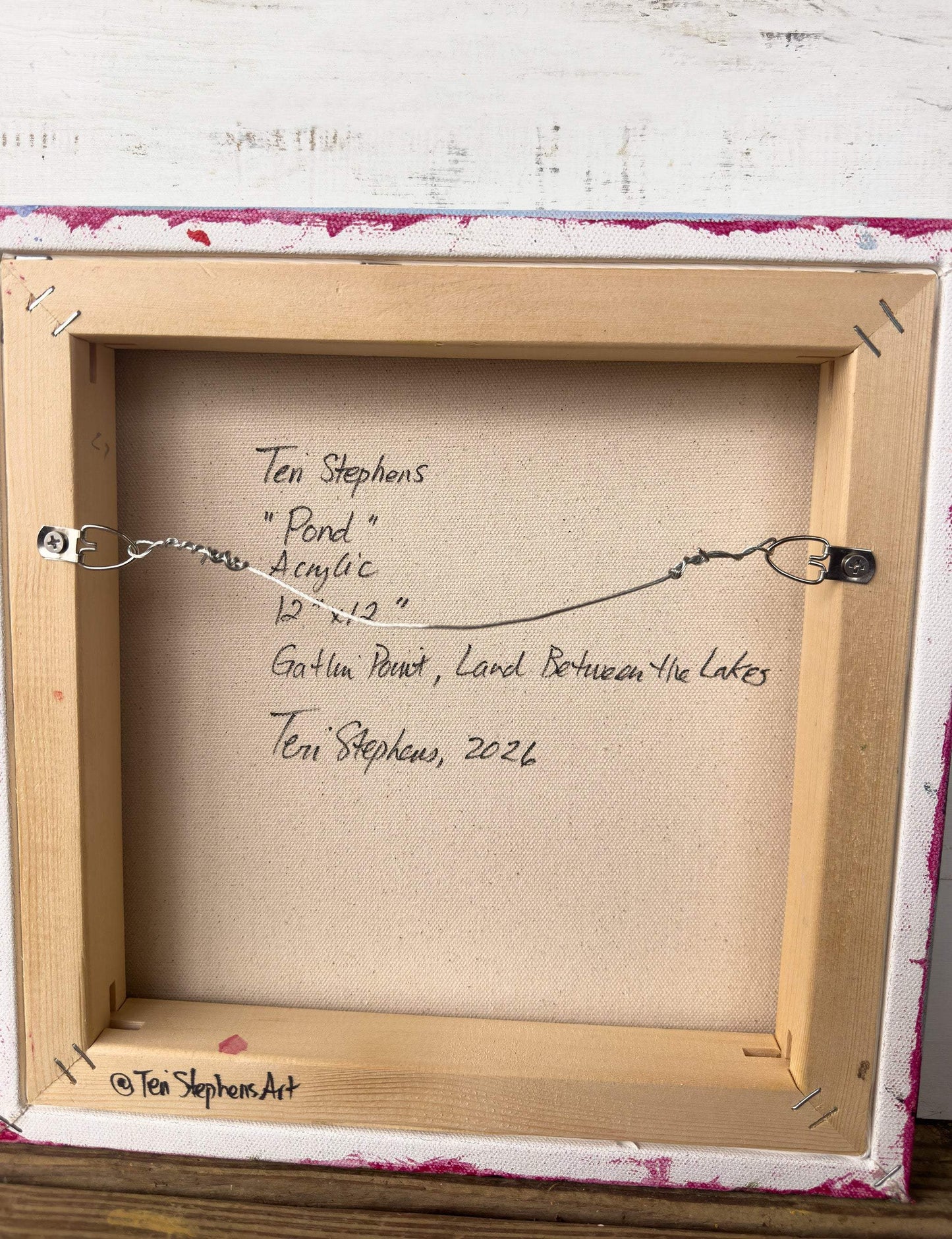 Artistic signature on a wooden frame with text, original painting titled "Pond" by Teri Stephens