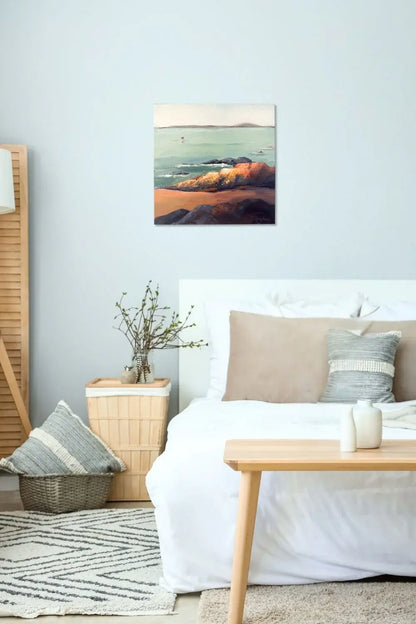 Cozy bedroom with a bed, table, and wall art titled "Rock" by Teri Stephens Art.