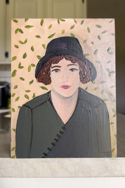 Portrait painting of a woman with a black hat on a patterned background, titled "Rue" by artist Teri Stephens
