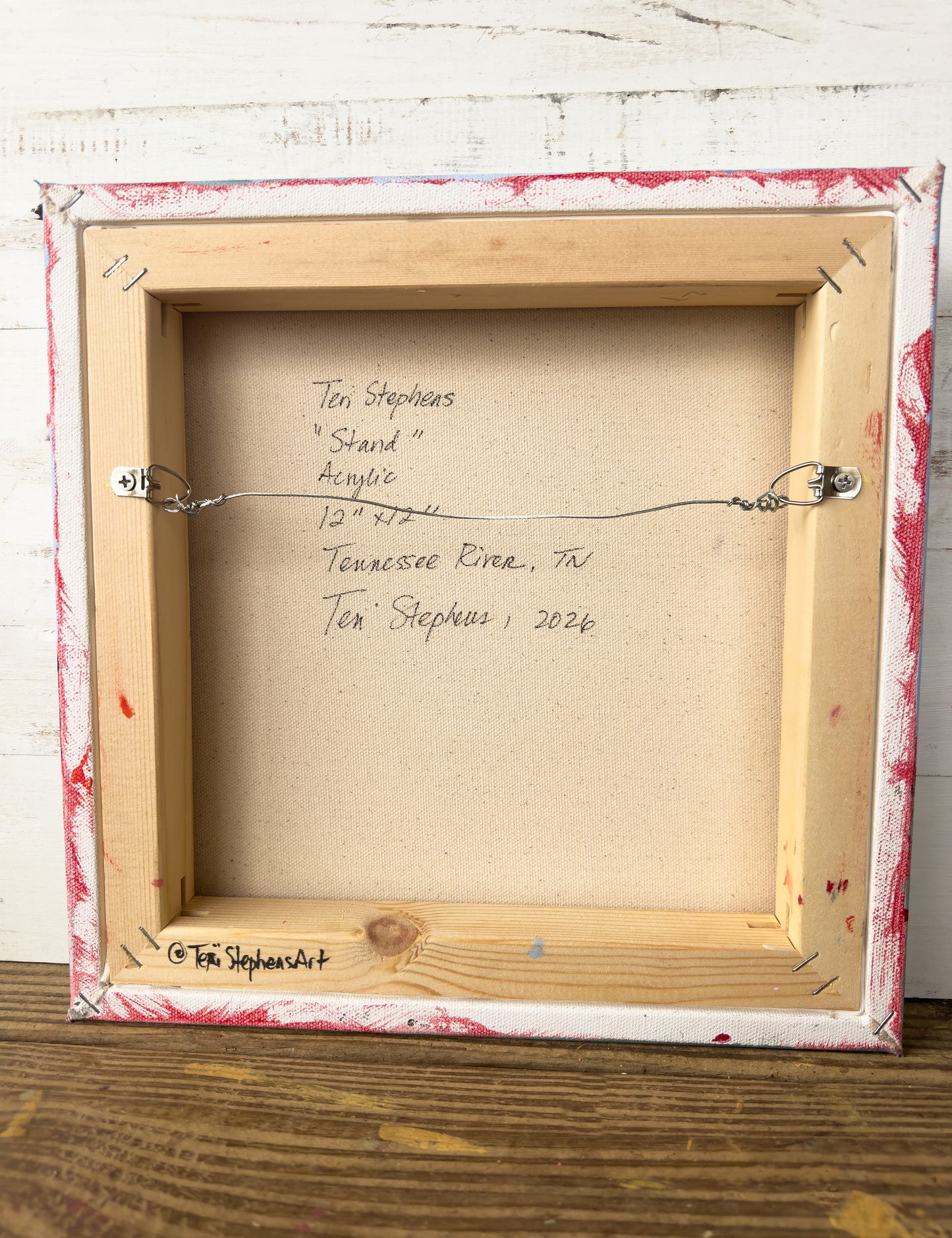 Wooden frame with signature on a textured background, "Stand" by Teri Stephens