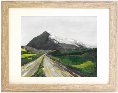 Framed painting of a mountain landscape with a road leading to a snow-capped peak. Summit by Teri Stephens